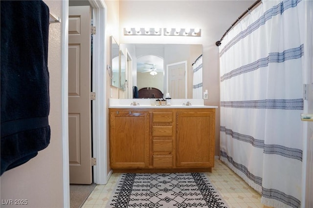 6170 E Sahara Ave Unit 1076, Las Vegas, NV 89142 - bathroom with tile patterned floors, ceiling fan, and double vanity