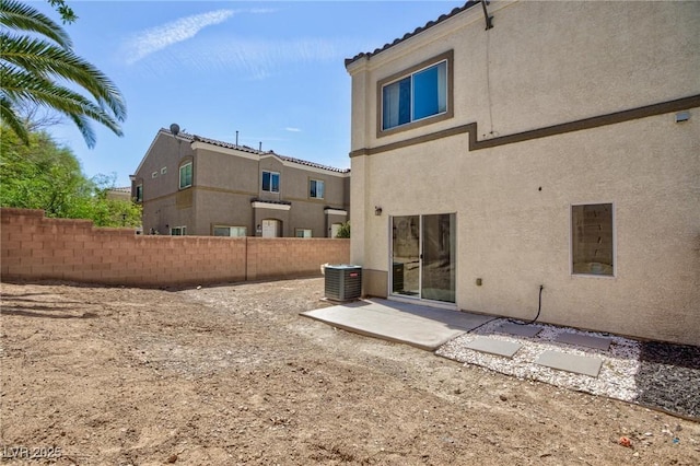 6170 E Sahara Ave Unit 1076, Las Vegas, NV 89142 - back of house with stucco siding and a patio