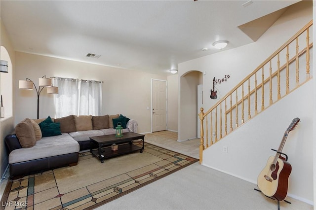 6170 E Sahara Ave Unit 1076, Las Vegas, NV 89142 - living area with arched walkways, stairway, and carpet