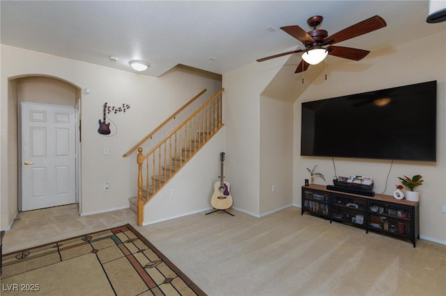 6170 E Sahara Ave Unit 1076, Las Vegas, NV 89142 - carpeted living area featuring stairs, ceiling fan, and arched walkways