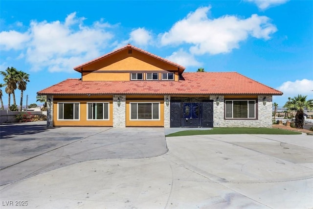 1385 Morning Sun Way, Las Vegas, NV 89110 - rear view of house with stone siding and a tile roof