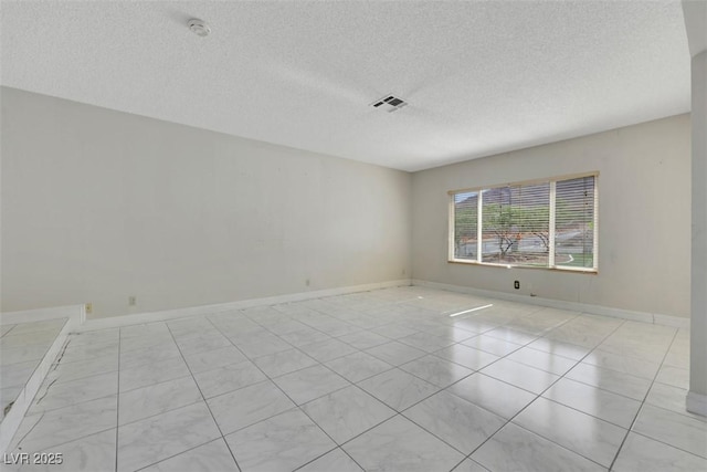 1385 Morning Sun Way, Las Vegas, NV 89110 - empty room featuring a textured ceiling, a smoke detector, and light tile patterned floors