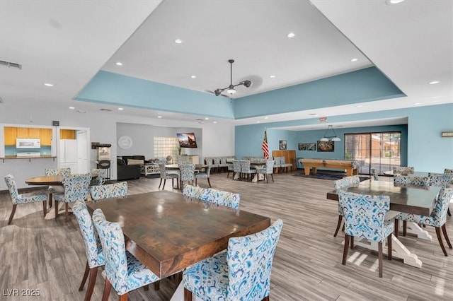2851 S Valley View Blvd Unit 1120, Las Vegas, NV 89102 - dining area featuring a raised ceiling, wood finished floors, recessed lighting, and pool table