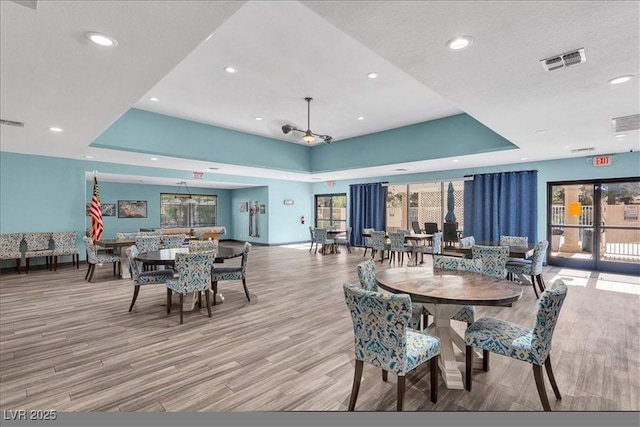2851 S Valley View Blvd Unit 1120, Las Vegas, NV 89102 - dining space with a raised ceiling, recessed lighting, and wood finished floors
