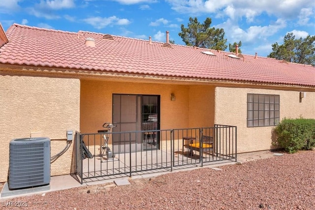 2851 S Valley View Blvd Unit 1120, Las Vegas, NV 89102 - rear view of property featuring stucco siding, a patio area, and a tiled roof