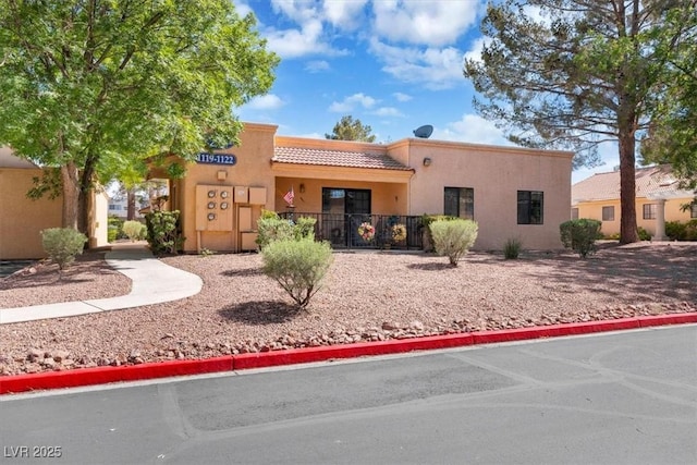 2851 S Valley View Blvd Unit 1120, Las Vegas, NV 89102 - view of front of property with a tiled roof and stucco siding