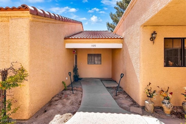 2851 S Valley View Blvd Unit 1120, Las Vegas, NV 89102 - property entrance with a tiled roof and stucco siding