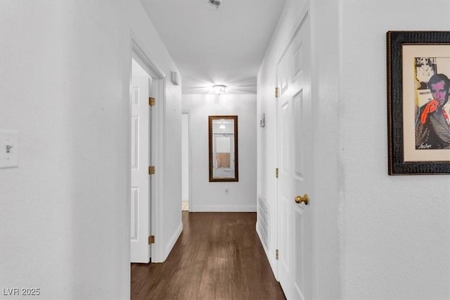 2851 S Valley View Blvd Unit 1120, Las Vegas, NV 89102 - corridor with dark wood-style flooring and baseboards