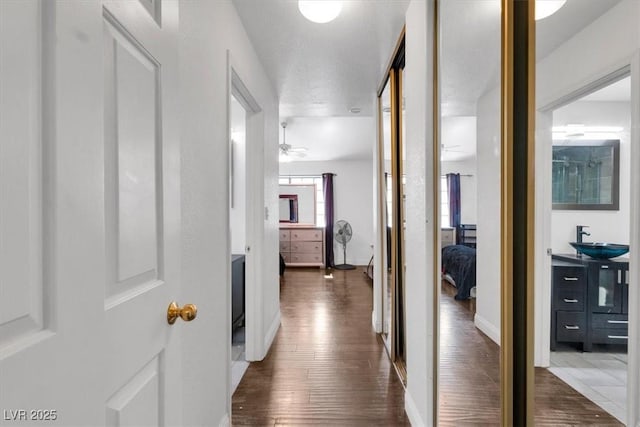 2851 S Valley View Blvd Unit 1120, Las Vegas, NV 89102 - hall featuring dark wood-type flooring