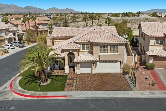 8970 Lansberry Ct, Las Vegas, NV 89147 - view of front facade featuring a tile roof, stucco siding, a garage, a residential view, and a mountain view