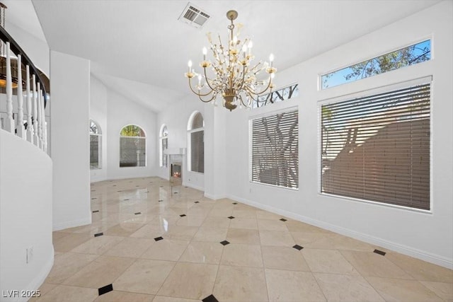8970 Lansberry Ct, Las Vegas, NV 89147 - unfurnished dining area featuring a chandelier, tile patterned flooring, and high vaulted ceiling