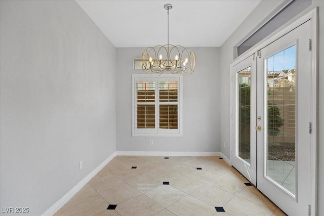 8970 Lansberry Ct, Las Vegas, NV 89147 - unfurnished dining area featuring a chandelier, healthy amount of natural light, french doors, and light tile patterned flooring