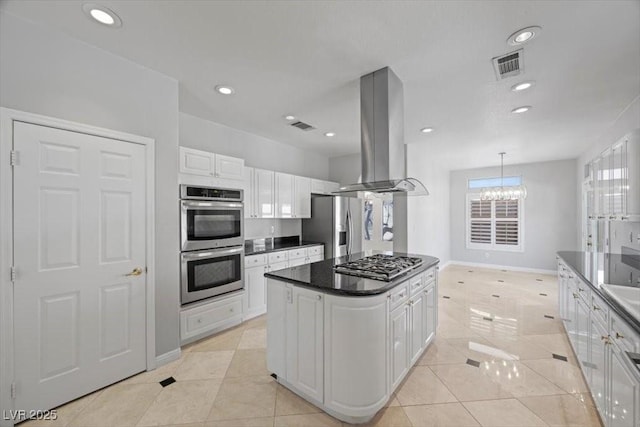8970 Lansberry Ct, Las Vegas, NV 89147 - kitchen featuring stainless steel appliances, island exhaust hood, white cabinets, a center island, and a chandelier