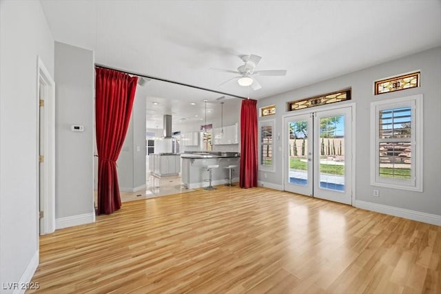 8970 Lansberry Ct, Las Vegas, NV 89147 - unfurnished living room with ceiling fan, wood finished floors, and french doors