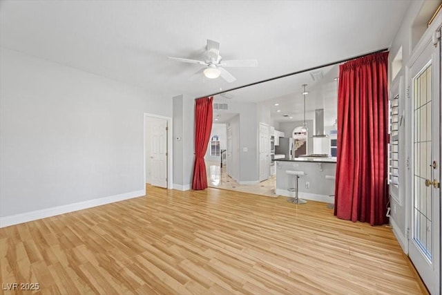 8970 Lansberry Ct, Las Vegas, NV 89147 - unfurnished living room featuring ceiling fan and light wood finished floors