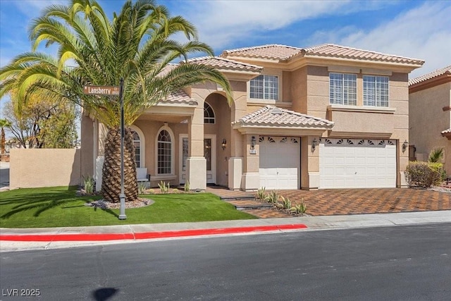 8970 Lansberry Ct, Las Vegas, NV 89147 - view of front facade with stucco siding, a tile roof, a garage, driveway, and a front yard