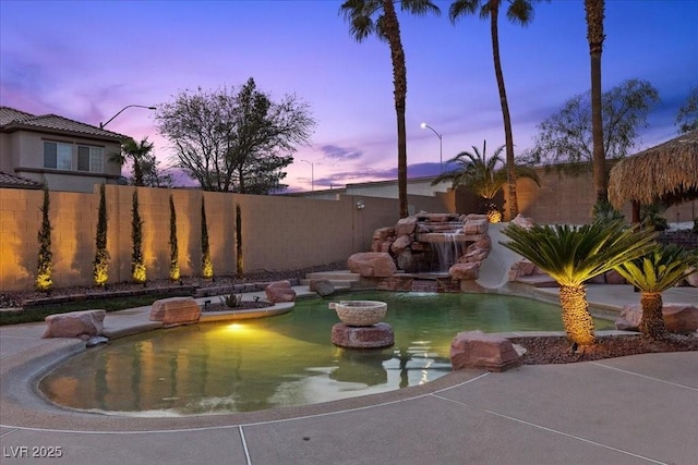 8970 Lansberry Ct, Las Vegas, NV 89147 - pool at dusk with a fenced backyard