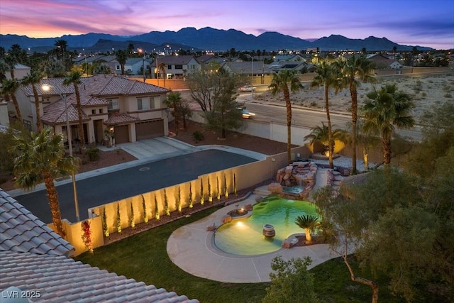 8970 Lansberry Ct, Las Vegas, NV 89147 - surrounding community featuring a garage, a mountain view, a residential view, and a fenced backyard