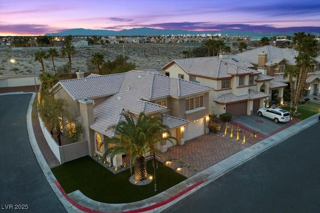 8970 Lansberry Ct, Las Vegas, NV 89147 - aerial view at dusk of a mountain view and a residential view