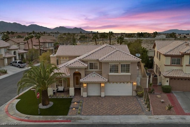 8970 Lansberry Ct, Las Vegas, NV 89147 - mediterranean / spanish-style house with a tile roof, a garage, driveway, stucco siding, and a residential view
