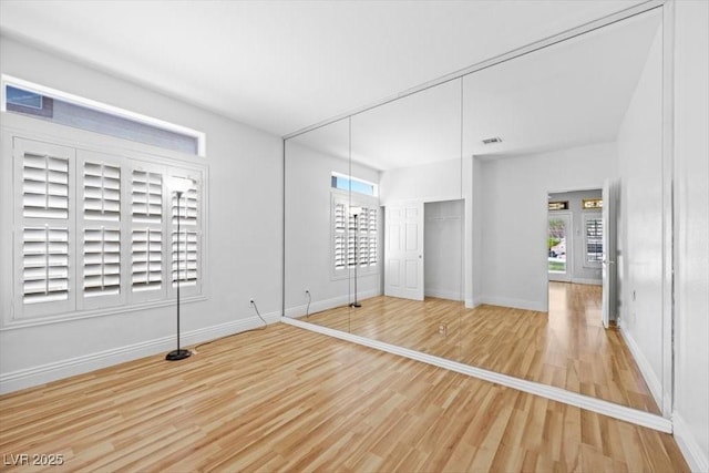 8970 Lansberry Ct, Las Vegas, NV 89147 - unfurnished bedroom with wood finished floors and a closet