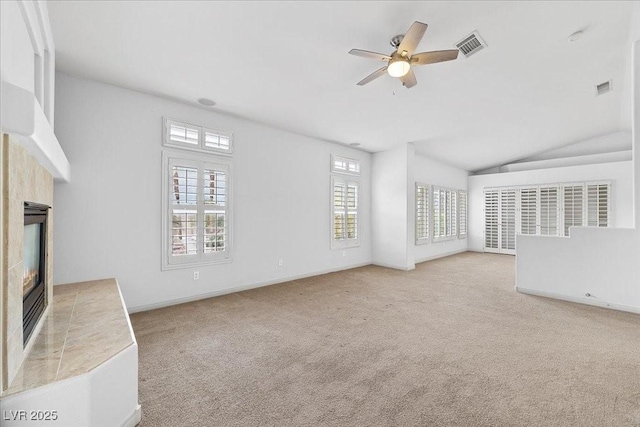 8970 Lansberry Ct, Las Vegas, NV 89147 - unfurnished living room with a tiled fireplace, a ceiling fan, carpet, and lofted ceiling