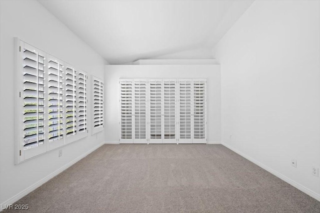 8970 Lansberry Ct, Las Vegas, NV 89147 - empty room with carpet flooring and vaulted ceiling