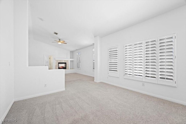 8970 Lansberry Ct, Las Vegas, NV 89147 - unfurnished living room featuring carpet, a ceiling fan, lofted ceiling, and a multi sided fireplace