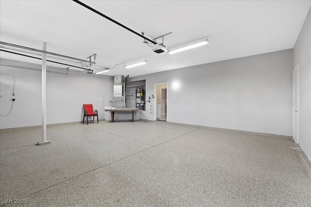 8970 Lansberry Ct, Las Vegas, NV 89147 - garage featuring a garage door opener and strapped water heater