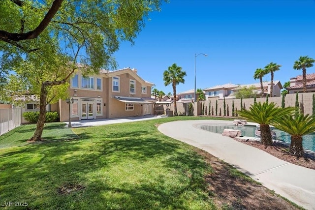 8970 Lansberry Ct, Las Vegas, NV 89147 - fenced backyard featuring french doors, a patio area, and a residential view