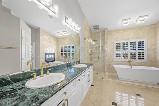 8970 Lansberry Ct, Las Vegas, NV 89147 - bathroom featuring double vanity, a soaking tub, and a shower stall