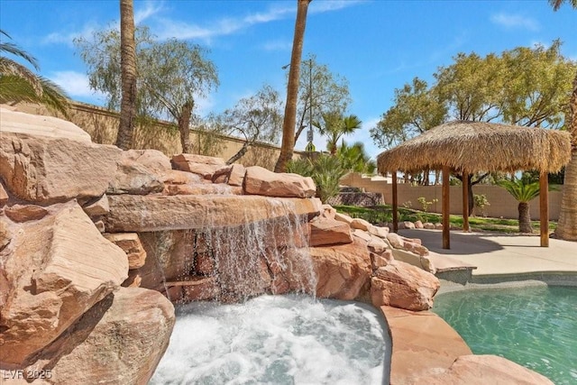 8970 Lansberry Ct, Las Vegas, NV 89147 - view of swimming pool featuring a fenced backyard, a patio, and a hot tub
