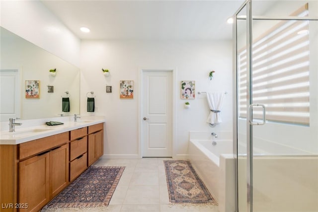 6927 Desert Finch St, North Las Vegas, NV 89084 - full bath with a garden tub, double vanity, a shower stall, tile patterned floors, and recessed lighting