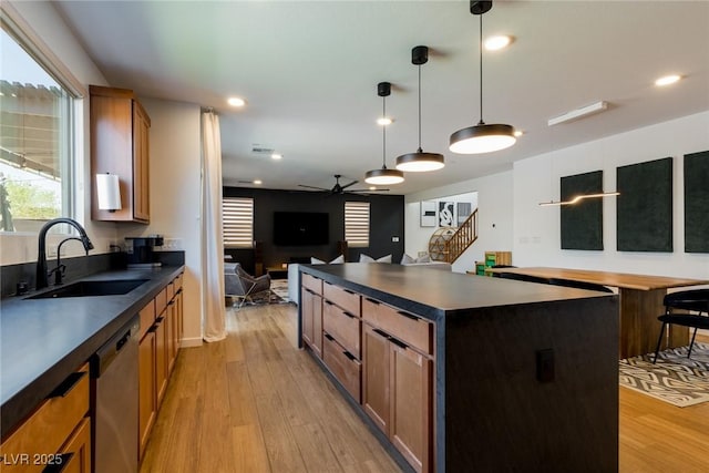 6927 Desert Finch St, North Las Vegas, NV 89084 - kitchen featuring stainless steel dishwasher, dark countertops, a ceiling fan, light wood finished floors, and recessed lighting