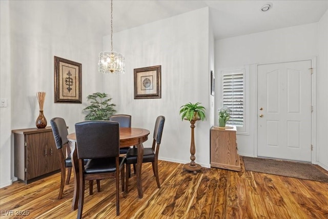 10413 Marymont Pl, Las Vegas, NV 89134 - dining room featuring wood finished floors and a chandelier