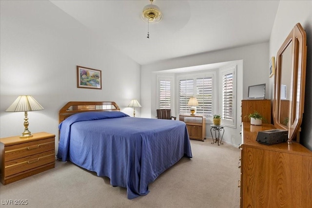 10413 Marymont Pl, Las Vegas, NV 89134 - bedroom featuring light colored carpet, vaulted ceiling, and ceiling fan