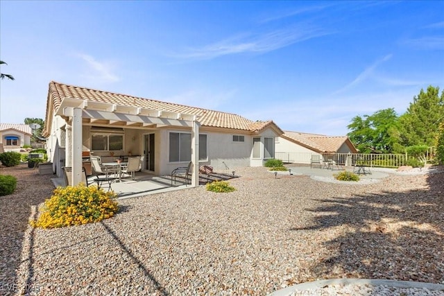 10413 Marymont Pl, Las Vegas, NV 89134 - rear view of property with a pergola, a patio area, stucco siding, and a tile roof