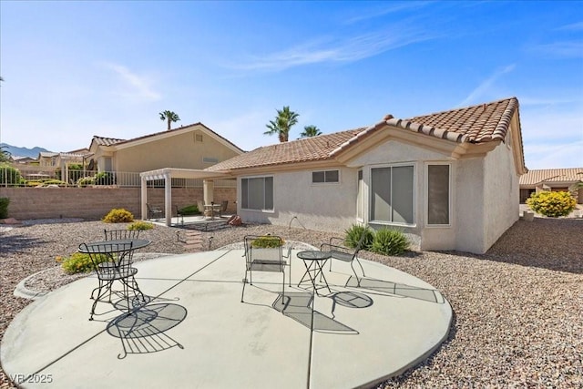 10413 Marymont Pl, Las Vegas, NV 89134 - rear view of property with stucco siding, a tile roof, a fenced backyard, and a patio area