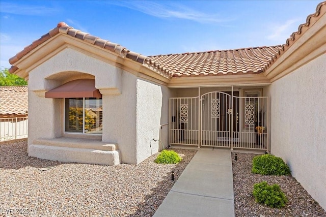10413 Marymont Pl, Las Vegas, NV 89134 - doorway to property with stucco siding and a tile roof