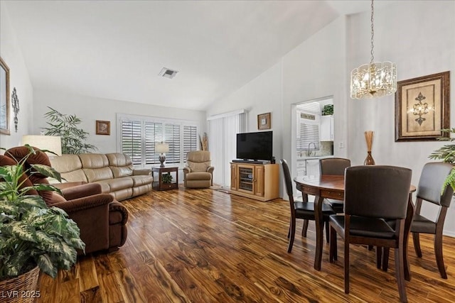 10413 Marymont Pl, Las Vegas, NV 89134 - living area featuring a chandelier, wood finished floors, and high vaulted ceiling