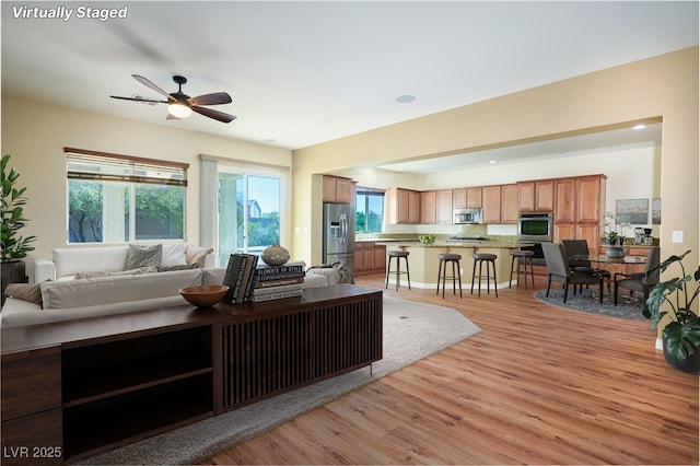 8604 Amber Autumn St, Las Vegas, NV 89131 - living room with light wood-style floors, ceiling fan, and recessed lighting