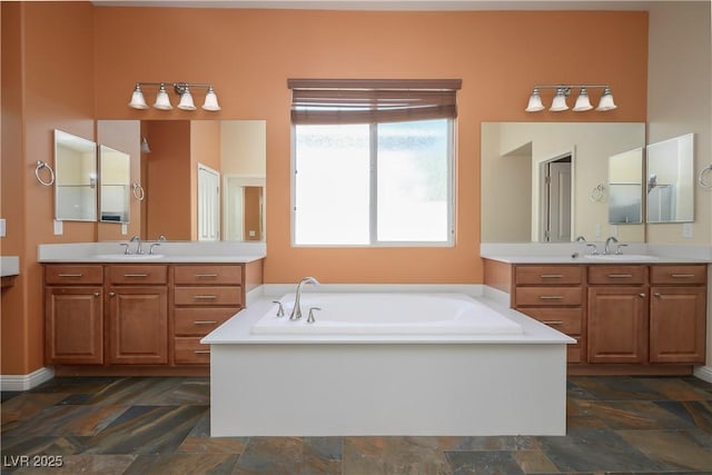 8604 Amber Autumn St, Las Vegas, NV 89131 - full bath with stone finish floors, a garden tub, and two vanities