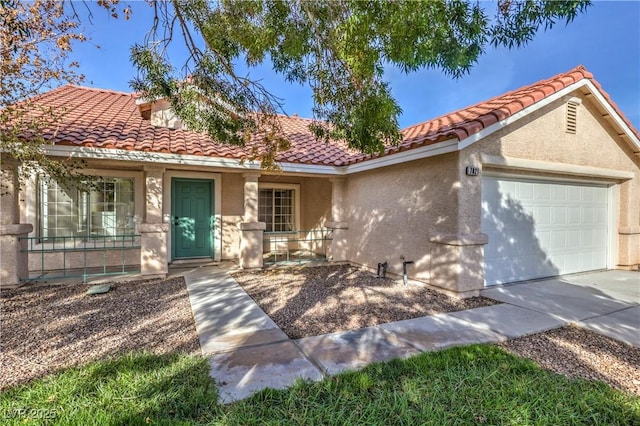 7021 Feather Pine St, Las Vegas, NV 89131 - view of front of house featuring a tile roof, a garage, stucco siding, driveway, and covered porch