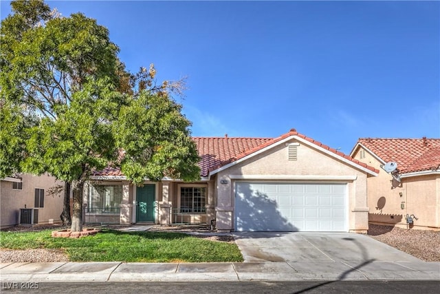 7021 Feather Pine St, Las Vegas, NV 89131 - view of front of home featuring an attached garage, stucco siding, concrete driveway, and a tile roof