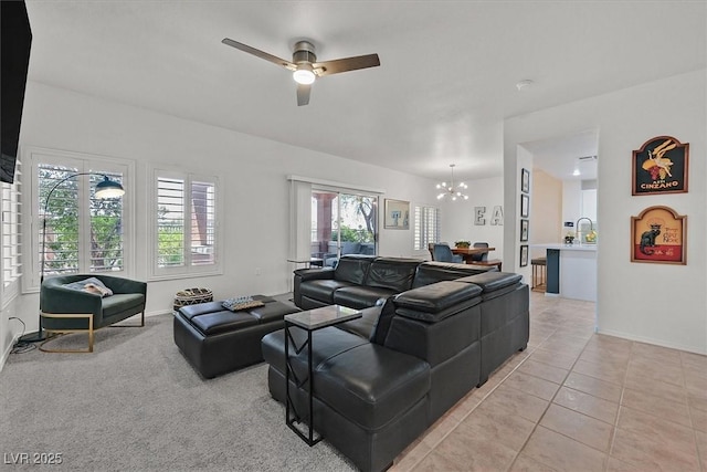 10640 Amber Ridge Dr Unit 101, Las Vegas, NV 89144 - living room with a chandelier, a ceiling fan, and light tile patterned flooring