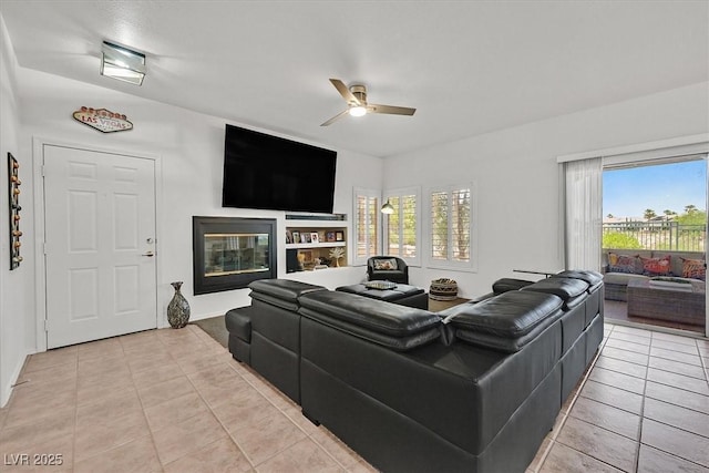 10640 Amber Ridge Dr Unit 101, Las Vegas, NV 89144 - living room featuring ceiling fan, light tile patterned floors, and plenty of natural light