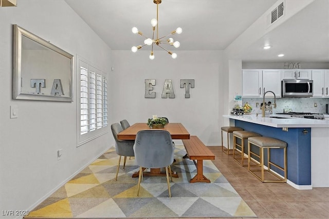 10640 Amber Ridge Dr Unit 101, Las Vegas, NV 89144 - dining room with a chandelier, light tile patterned floors, and recessed lighting