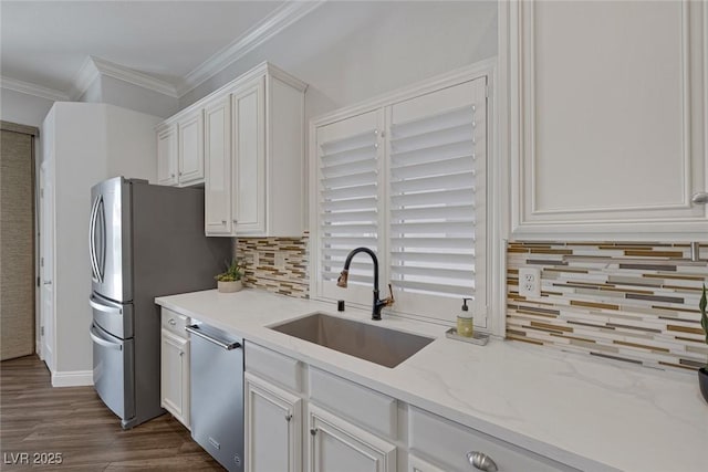 12 Golden View St, Henderson, NV 89012 - kitchen featuring stainless steel appliances, white cabinets, dark wood-style flooring, crown molding, and tasteful backsplash