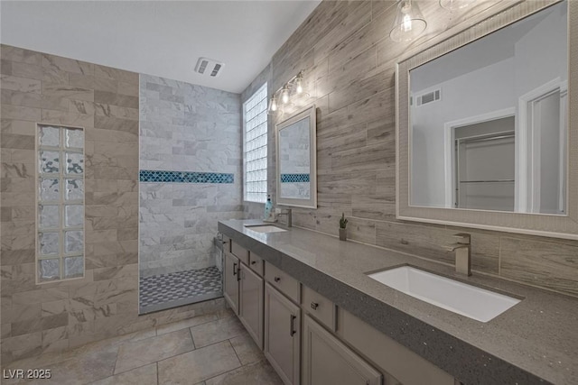 12 Golden View St, Henderson, NV 89012 - bathroom featuring double vanity, walk in shower, backsplash, and tile patterned floors