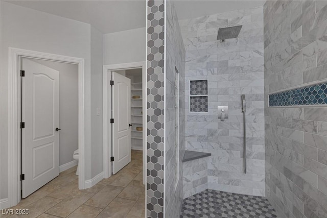 12 Golden View St, Henderson, NV 89012 - bathroom with tiled shower, tile patterned flooring, and a walk in closet